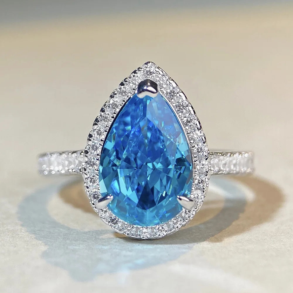 Lumilux Platinum Pear Solitaire Ring — PT950 | Diamond & Moissanite | Blue, Yellow, Pink & Purple