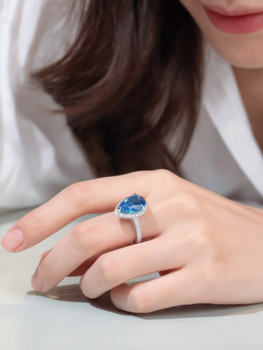 Lumilux Platinum Pear Solitaire Ring — PT950 | Diamond & Moissanite | Blue, Yellow, Pink & Purple